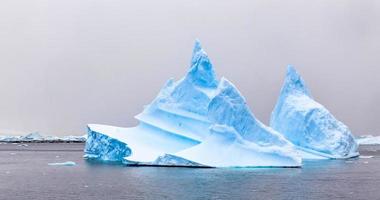 Blue Icebergs drifting at port Charcot, Booth island, Antarctic peninsula