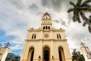 Facade of basilica in honour of Our Lady of Charity with palm, El Cobre, Santiago de Cuba, Cuba photo