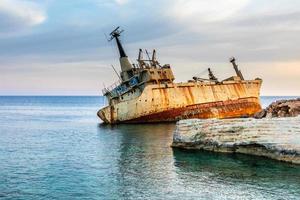 Abandoned rusty ship stranded ashore nearby Peyia village, Paphos, Cyprus