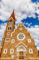 Luteran Christ Church facade with blue sky and clouds in background, Windhoek, Namibia photo