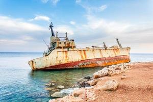 Abandoned rusty ship stranded ashore nearby Peyia village, Paphos, Cyprus