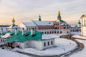 New Jerusalem Monastery inner yard with churches and buildings covered in snow, Istra, Moscow region photo