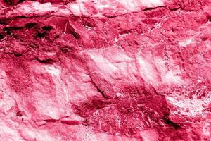 Rustic rough marble texture, Matt granite ceramic tile. viva magenta color of the year 2023. photo