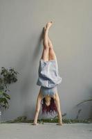 Handstand against wall funny pose scenic photography photo