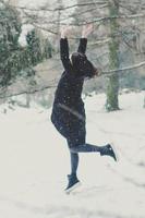 Jumping in excitement of first snowfall scenic photography photo