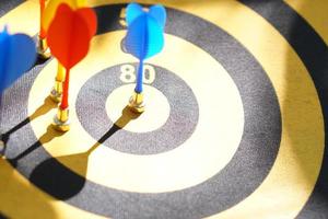 Darts on black and yellow targets photo
