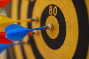 Darts on black and yellow targets photo