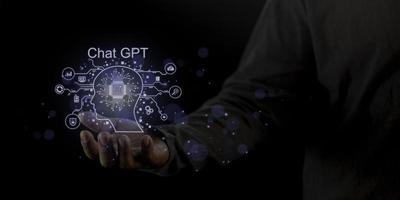 Businessman holding a light chatbot icon. Chat GPT AI or Artificial intelligence using chatbot generate photo