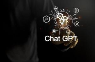 Businessman holding a light chatbot icon. Chat GPT AI or Artificial intelligence using chatbot generate photo