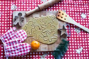 Making gingerbread man and christmas cookies photo