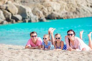 Young beautiful family on beach during european vacation photo