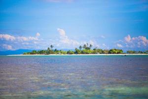 Uninhabited tropical island in the open ocean in the Philippines photo