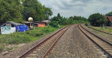 Two railroad tracks close to each other photo