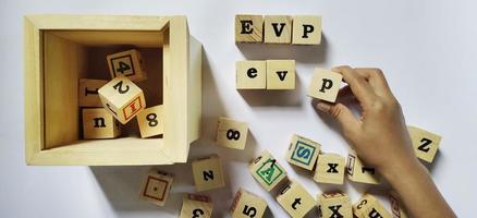 EVP employee value proposition, conceptual business illustration in wooden cubes photo