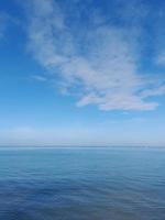 Relaxing seascape with wide horizon of the sky and the sea. photo