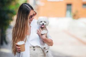 Woman with coffee outdoors on the promenade photo