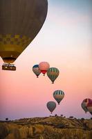Bright hot air balloons in sky of Cappadocia, Turkey photo