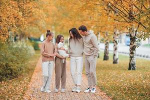 Portrait of happy family of four in autumn photo