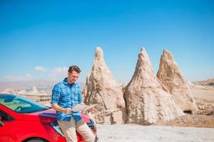 Happy man on summer vacation in famous place. Cave formations. photo