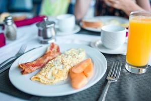 Healthy tasty breakfast on table in outdoor cafe photo