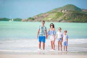 Happy beautiful family on the beach photo