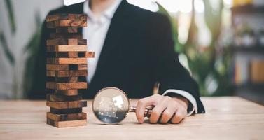 solution concept and demonstrating leadership strategies,Creativity that will lead business in right direction,with innovation and brain power from brainstorming,businessman holding a magnifying glass photo