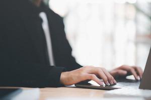 business accounting documents,auditor,management and auditing of office documents,Reports for Tax Time Analysis,Office worker working with laptop at office,Checking through internet technology photo
