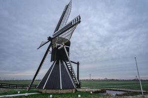 Mellemolen, dutch windmill in Akkrum, the Netherlands. In the winter with Some snow. photo