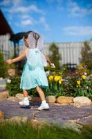 Little girl running around with wings on his back like a butterfly photo