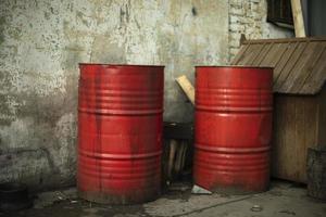 Red barrels of fuel. Steel barrels in industrial area. Cesternes in yard of warehouse. photo
