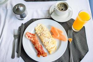 Healthy tasty breakfast on table in outdoor cafe photo