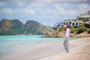 Young fashion woman in swimsuit on the beach photo