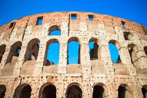 Colosseum or Coliseum background blue sky in Rome photo