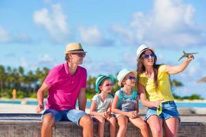 Family vacation. Airplane in woman hand. photo