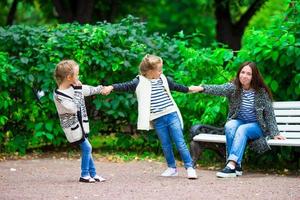 Happy family having fun on beautiful autumn day photo