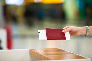 Closeup passports and boarding pass at airport indoor photo