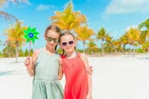 Adorable little girls during summer tropical vacation photo