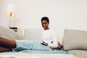 woman using laptop at home photo