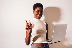 black woman person using laptop photo