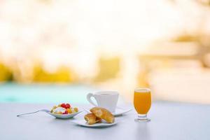 Healthy breakfast in outdoor cafe in the morning photo