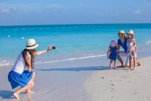 Happy beautiful family on caribbean holiday vacation photo