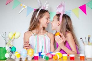 Happy easter. Beautiful little kids wearing bunny ears on Easter day. photo