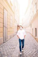 Young man background the old european city take selfie photo