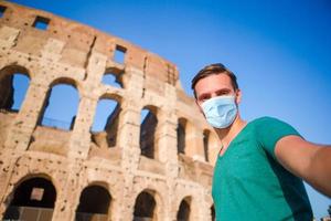 Happy family in Europe. Man in Rome over Coliseum background photo