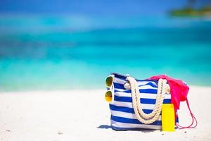 Beach accessories on white tropical beach photo