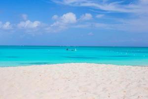 Perfect white beach with turquoise water at ideal island photo