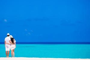 Young happy couple during beach vacation photo