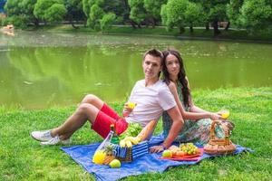 Young couple in love on a picnic outdoors photo