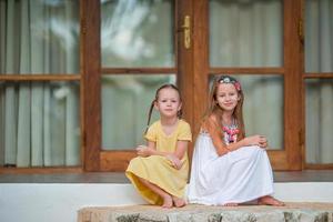 Adorable little girls on summer exotic vacation photo