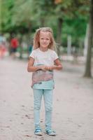 Adorable fashion little girl outdoors in the Tuileries Gardens, Paris photo